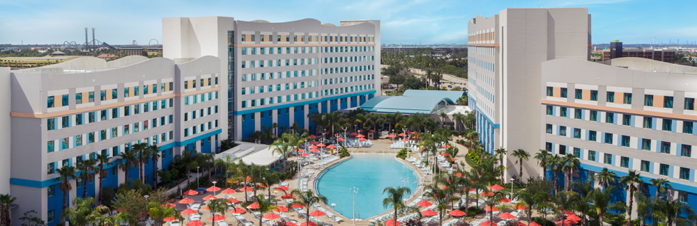 The two hotel towers of Universal’s Endless Summer – Surfside Inn and Suites with a large surfboard-shaped pool in between them.